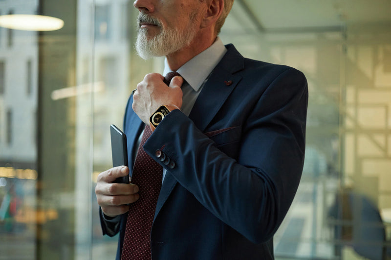 A businessman in a suit wearing The Trevit Smartwatch