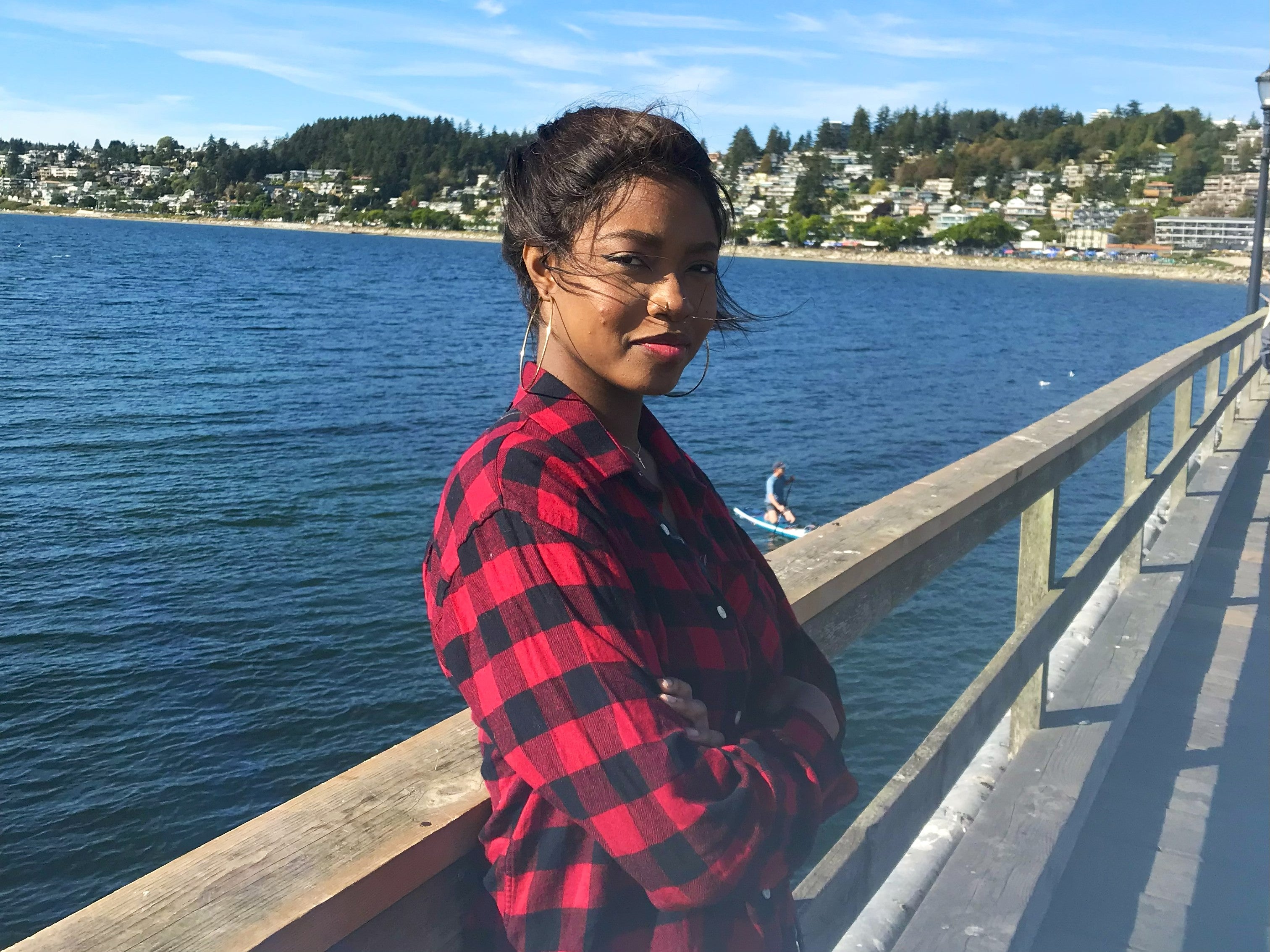 Photo of a guy holding up his hand with a smartwatch and text with dollar signs and 'Worth the hype'